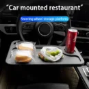 Multifunctional car steering tray used as a laptop desk and portable food tray for drivers.
