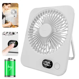 Compact mini desk fan with a foldable stand sitting on a student study table.