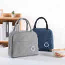 Insulated lunch handbag with aluminum foil lining for bento boxes and meal prep storage.