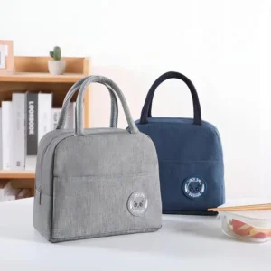 Insulated lunch handbag with aluminum foil lining for bento boxes and meal prep storage.