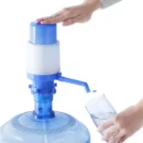 Manual hand pressure bottles pump for drinking water fountains with food-grade plastic and extra tube.