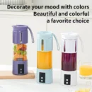 Portable electric juicer cup for fresh juice and kitchen food processing. 1