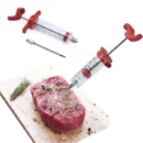 Stainless steel seasoning injector needle being inserted into a raw turkey breast on a kitchen counter.