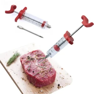 Stainless steel seasoning injector needle being inserted into a raw turkey breast on a kitchen counter.