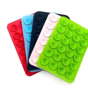 Non-slip silicone mobile pad with multiple suction cups attached to the back of a smartphone.