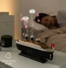 Ocean liner aroma diffuser with jellyfish spray effect and colorful LED lights for room decor.