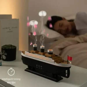 Ocean liner aroma diffuser with jellyfish spray effect and colorful LED lights for room decor.