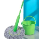 Long-handled 2-in-1 dehydrated cleaning mop being used for wet and dry floor cleaning on hardwood.