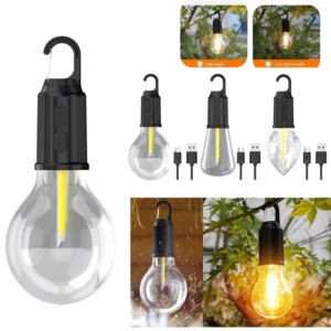 Vintage hanging outdoor lantern glowing with warm light inside a camping tent.