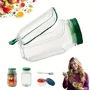 Minimalist olive green salad container filled with fresh greens and a centered leak-proof dressing pod on a wooden office desk.