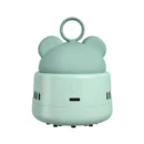 Lake green mini vacuum cleaner in the shape of a cute cartoon bear head sitting on a modern office study desk.