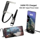 Black braided 240W PD fast charging cable plugged into a smartphone that rests on the cable's built-in foldable stand.
