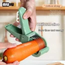 Stainless steel multi-functional vegetable slicer cutting uniform potato slices on a modern white kitchen countertop.