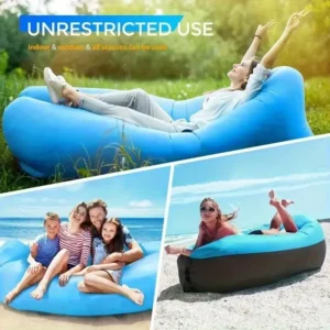 Bright orange inflatable camping mattress couch sitting on a sandy beach during a sunny afternoon.