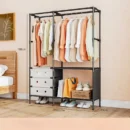 Black metal double row standing coat rack with hung jackets, bags on side hooks, and shoes neatly placed on bottom shelves in an entryway.