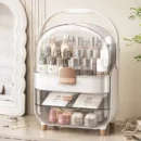 Elegant white extra large cosmetic organizer with a clear dust-proof dome top resting on a clean marble bathroom vanity.