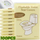 Individual pocket pack of biodegradable flushable disposable toilet paper seat mats resting on a clean public restroom counter.